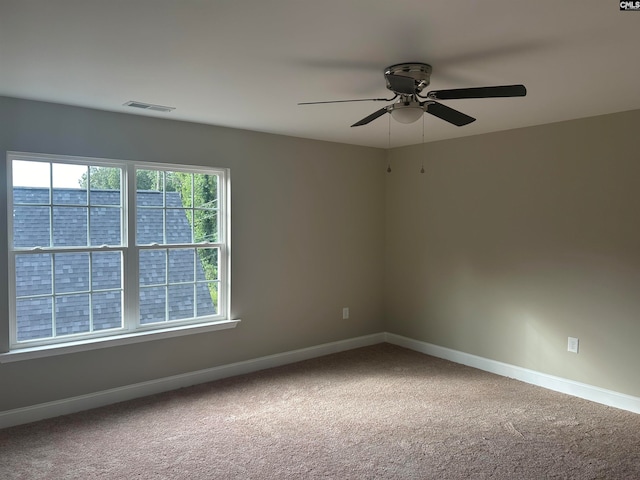 unfurnished room featuring carpet flooring and ceiling fan