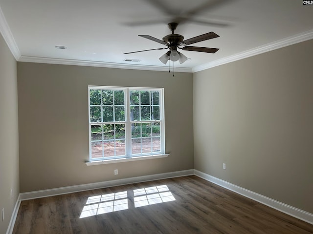 spare room with ornamental molding, dark wood-type flooring, and ceiling fan