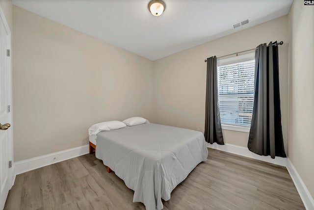 bedroom featuring hardwood / wood-style flooring