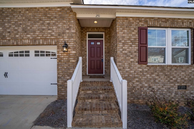 doorway to property featuring a garage