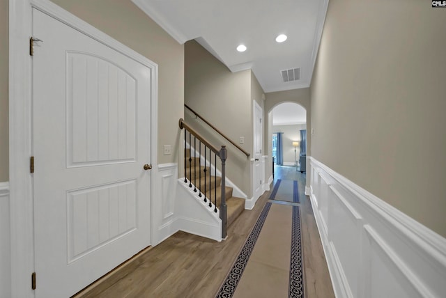 interior space featuring crown molding and hardwood / wood-style flooring