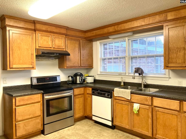 kitchen featuring sink, light tile patterned floors, a textured ceiling, stainless steel range with electric stovetop, and dishwasher