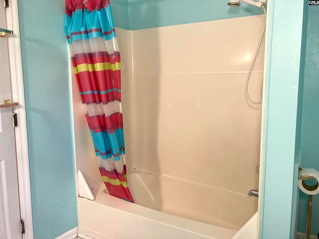 bathroom with shower / bathtub combination with curtain