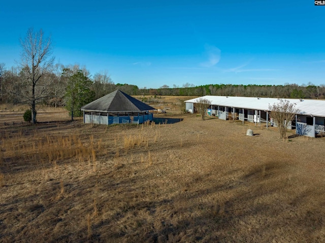 view of yard featuring a rural view and a gazebo