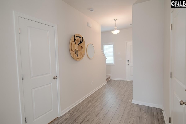 hallway with light wood-type flooring