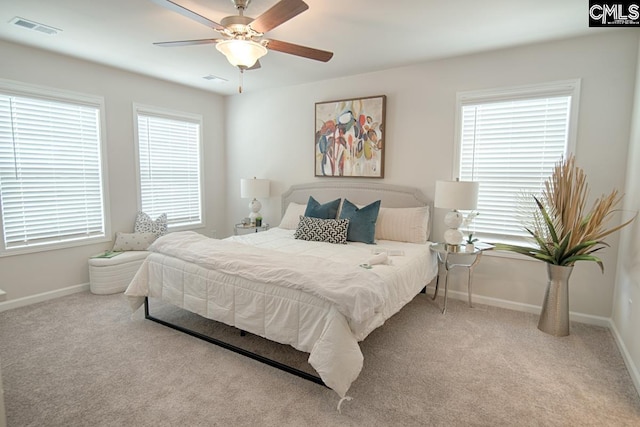 bedroom featuring light carpet and ceiling fan