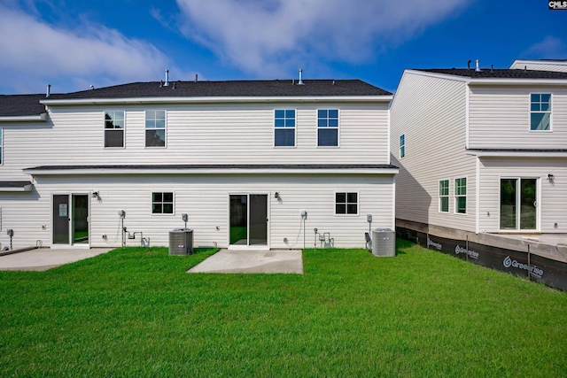 back of house featuring a yard, a patio area, and central air condition unit