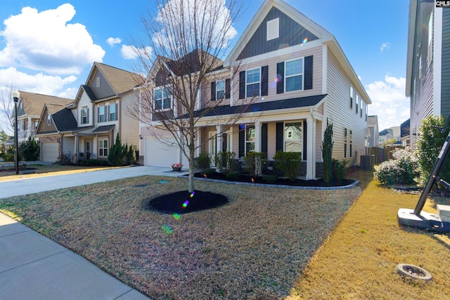 view of front of property featuring central AC unit and a garage