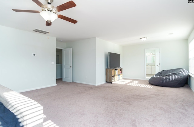 interior space with ceiling fan and light carpet