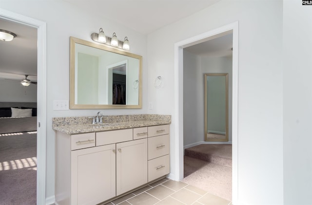 bathroom featuring ceiling fan, tile flooring, and vanity