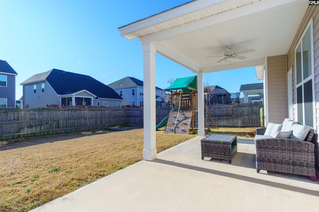 view of patio / terrace featuring a playground, outdoor lounge area, and ceiling fan