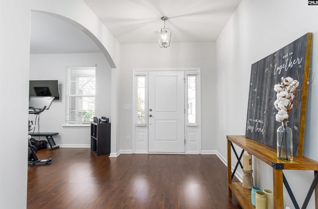 foyer with dark hardwood / wood-style flooring