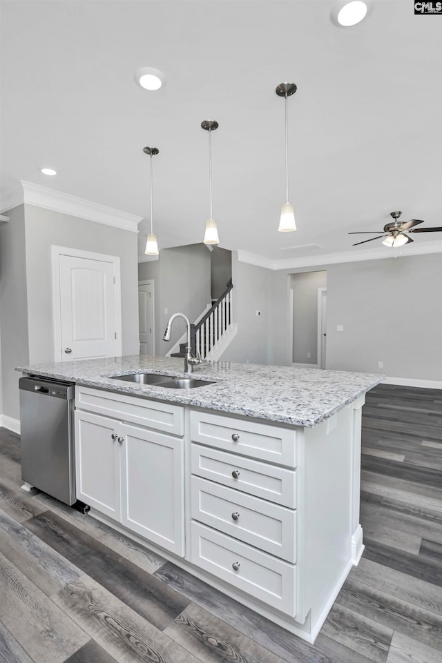 kitchen featuring pendant lighting, dishwasher, white cabinetry, and sink