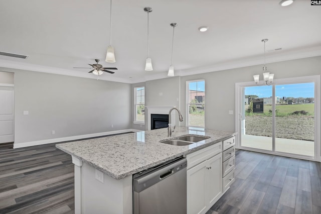 kitchen with a kitchen island with sink, sink, stainless steel dishwasher, dark hardwood / wood-style flooring, and white cabinetry