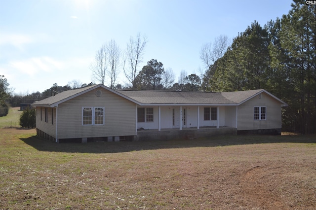 single story home featuring a front lawn