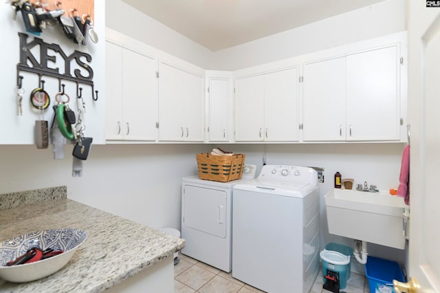 230 Wildlife Rd, Lexington, SC 29072 - clothes washing area featuring washing machine and clothes dryer, cabinets, sink, and light tile floors