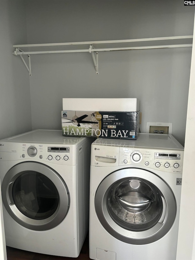 laundry area featuring washing machine and clothes dryer