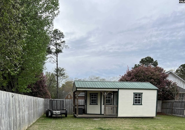 view of outdoor structure featuring a lawn