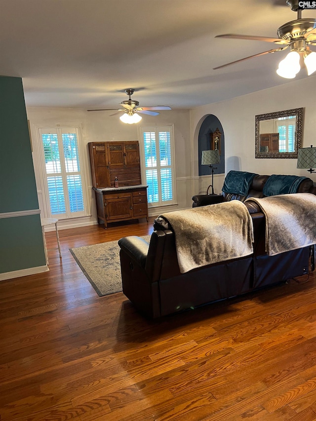 bedroom featuring dark hardwood / wood-style flooring and ceiling fan