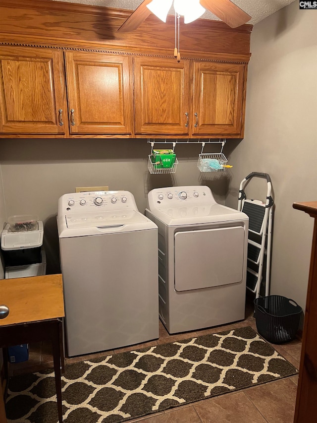 clothes washing area with ceiling fan, tile flooring, cabinets, and separate washer and dryer