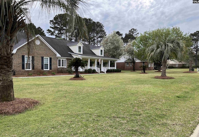 view of front of house featuring a porch and a front lawn