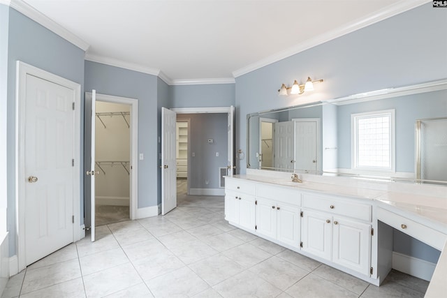 bathroom featuring vanity, tile floors, and crown molding