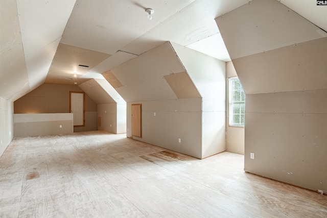 bonus room featuring lofted ceiling