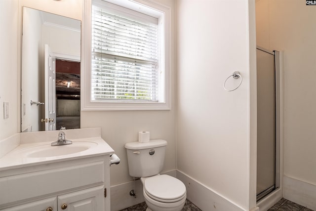 bathroom featuring tile flooring, toilet, large vanity, and walk in shower