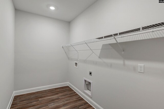 washroom with baseboards, hookup for an electric dryer, washer hookup, and laundry area