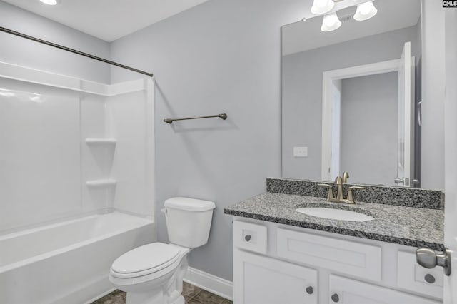 bathroom with tile patterned floors, toilet,  shower combination, baseboards, and vanity