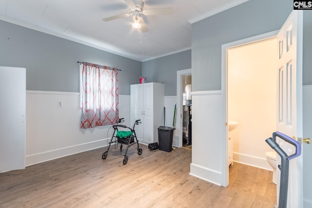 interior space featuring crown molding, light hardwood / wood-style floors, and ceiling fan