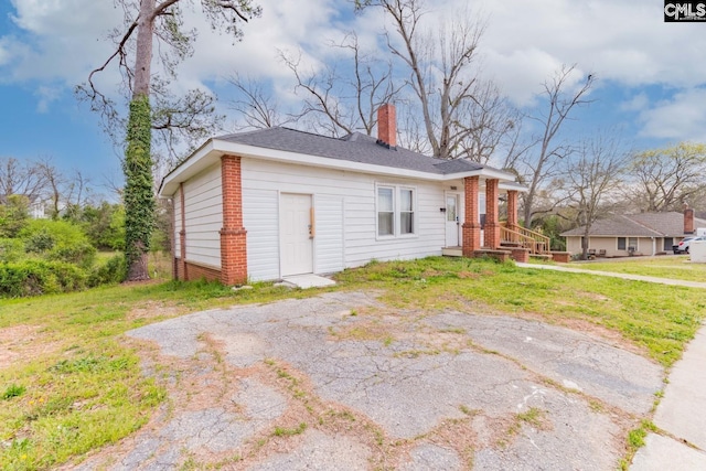 exterior space with a yard