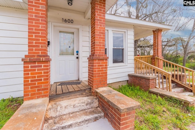 doorway to property with a porch