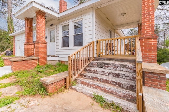 entrance to property with covered porch