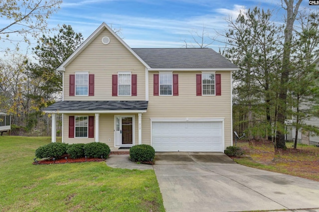 view of front of house with a front lawn and a garage