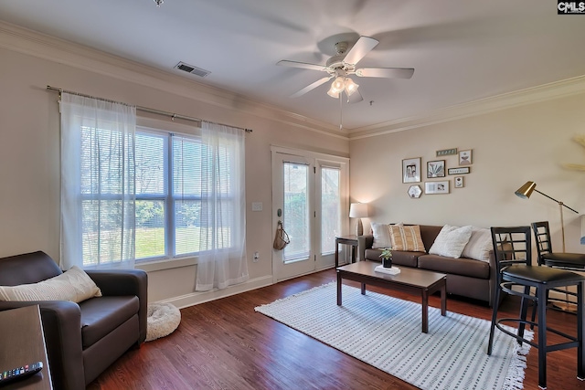 living room with ceiling fan, crown molding, and dark hardwood / wood-style floors