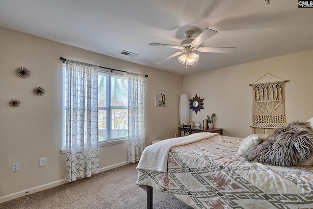 bedroom with ceiling fan and light colored carpet