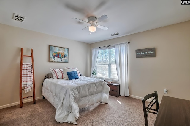 bedroom with ceiling fan and dark colored carpet