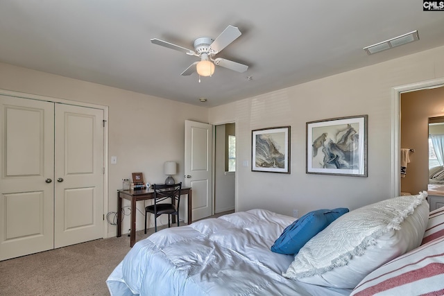 carpeted bedroom featuring a closet and ceiling fan