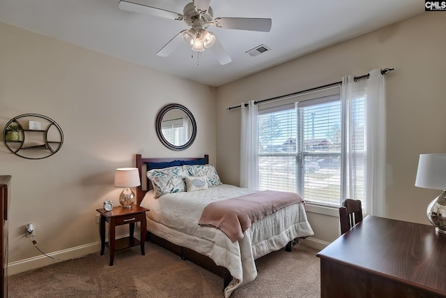 bedroom featuring dark colored carpet and ceiling fan