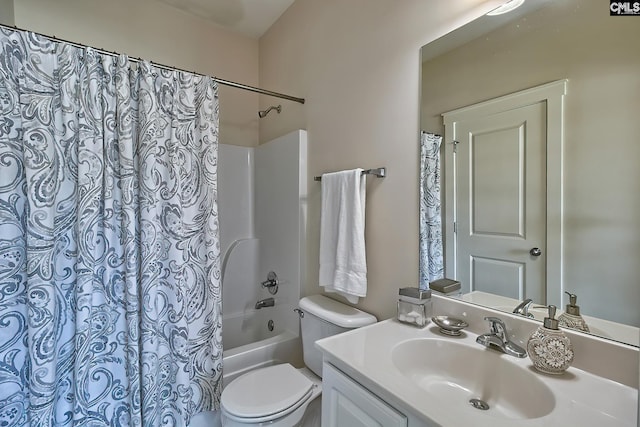 full bathroom with shower / bath combo with shower curtain, toilet, and vanity