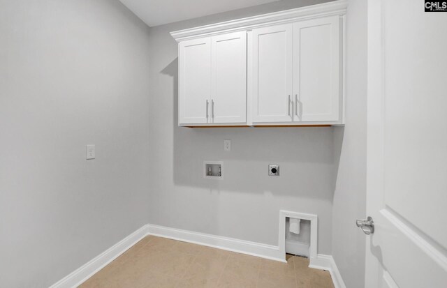 washroom featuring cabinets, washer hookup, and hookup for an electric dryer