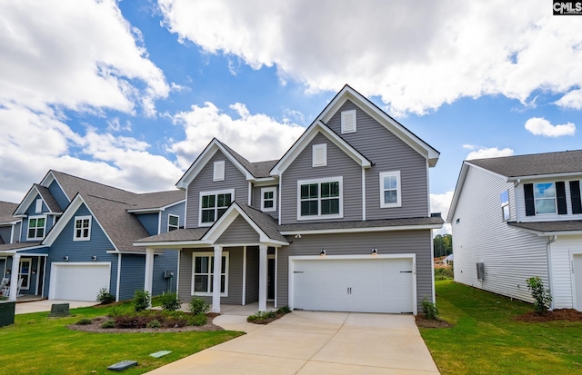 craftsman house featuring a garage, a porch, and a front yard