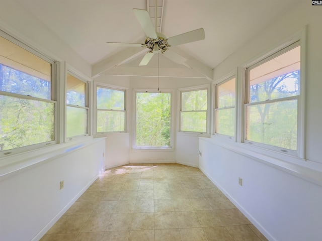 unfurnished sunroom with lofted ceiling, ceiling fan, and plenty of natural light