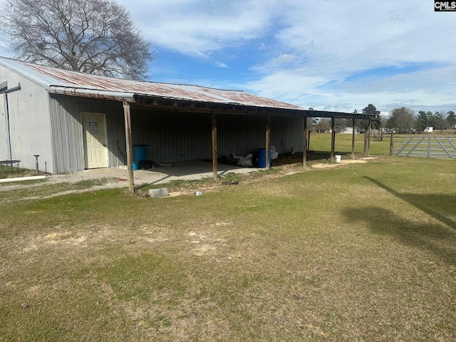 view of outbuilding with a lawn