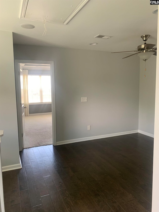 unfurnished room with dark hardwood / wood-style floors and ceiling fan