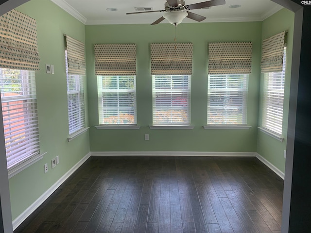 empty room featuring ceiling fan, dark hardwood / wood-style flooring, and ornamental molding