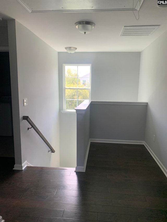 corridor featuring dark hardwood / wood-style floors