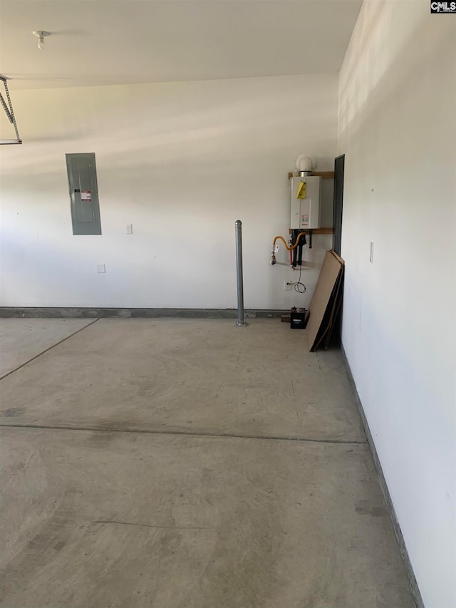 garage featuring electric panel and water heater