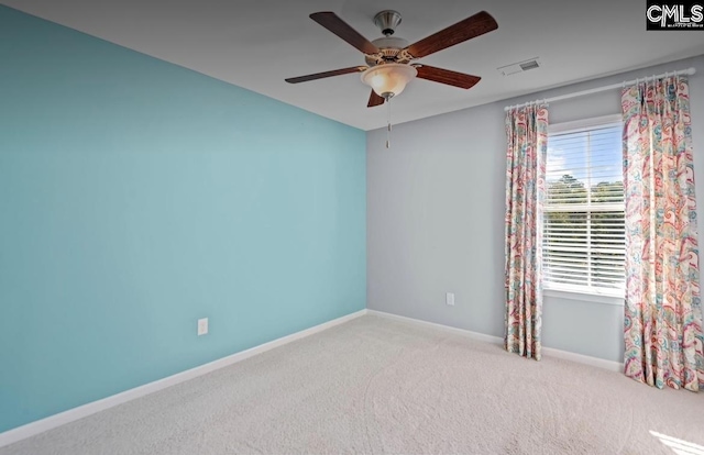 unfurnished room featuring ceiling fan and light colored carpet